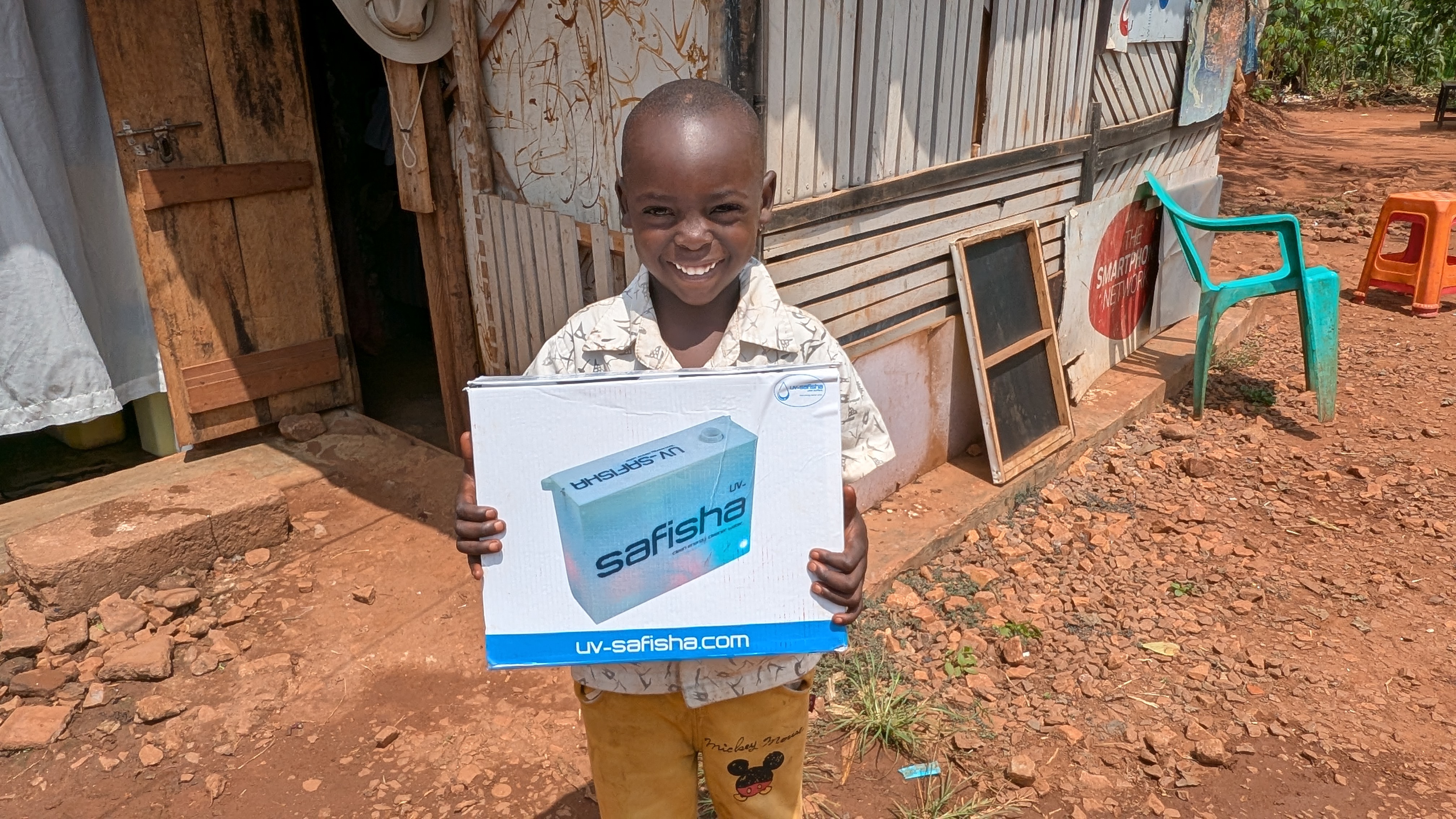 Jacob holding a UV-Safisha purifier